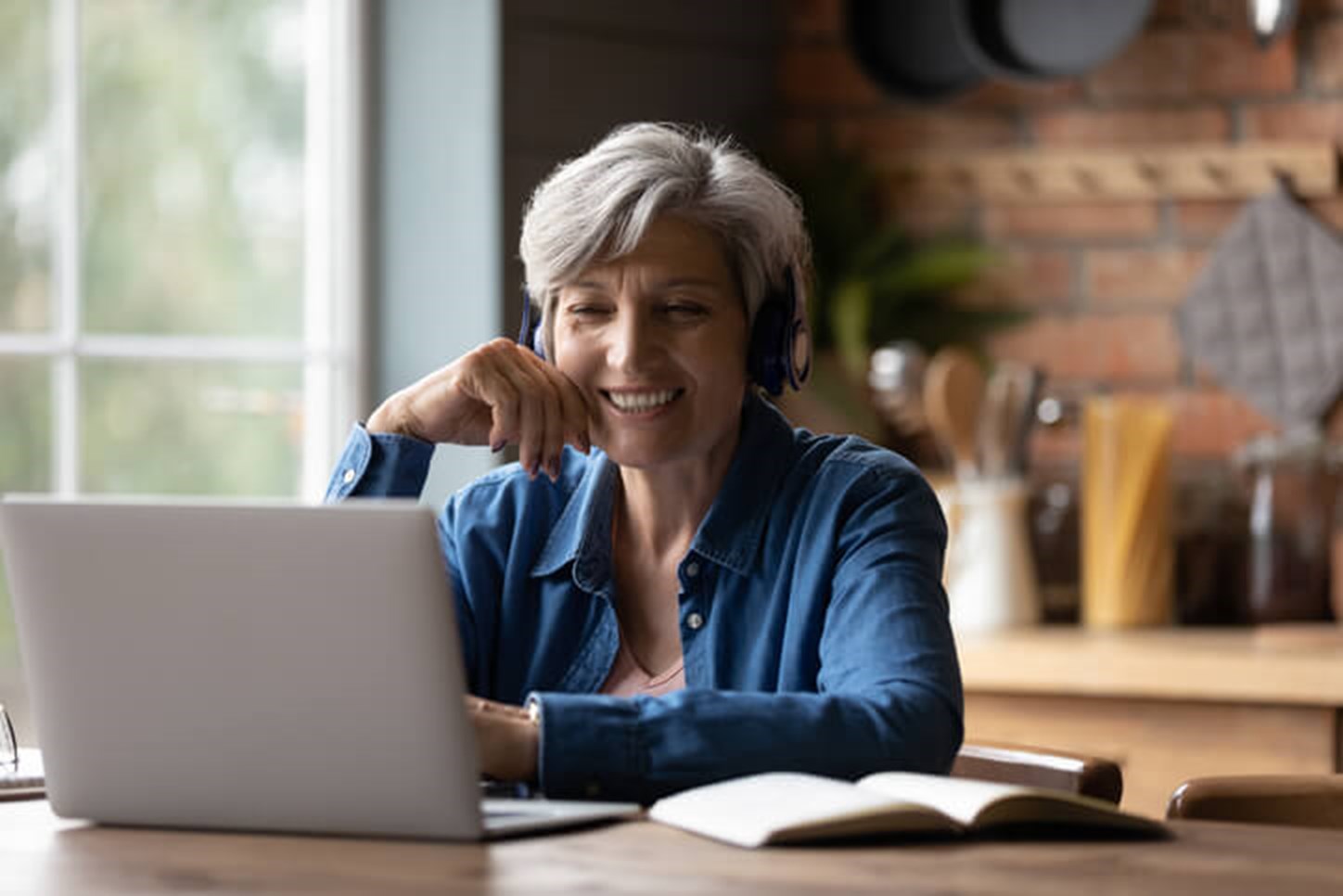 Woman on a laptop in her kitchen