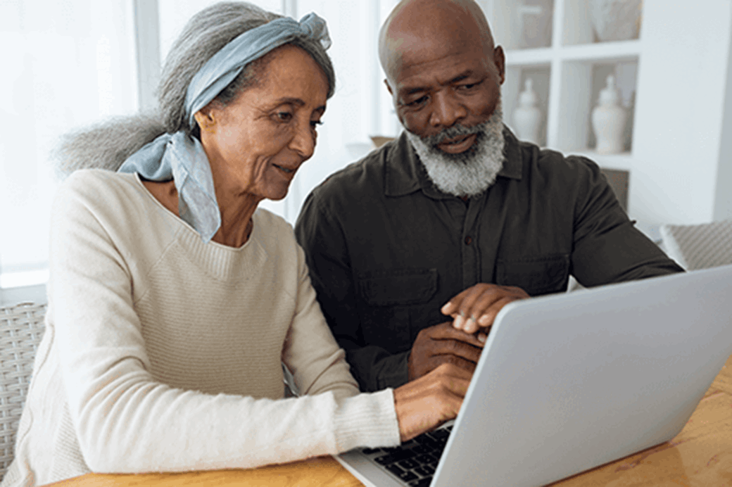 older couple using a laptop