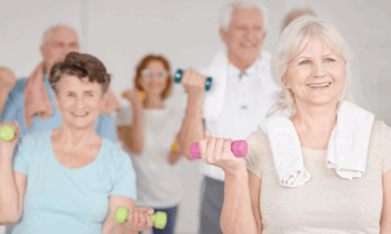 People lifting weights at a fitness class