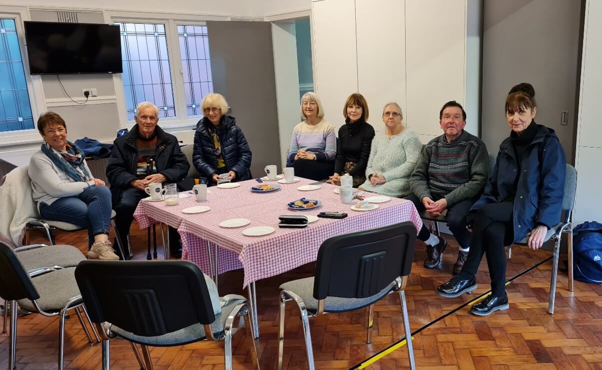 A group of people sit at a table