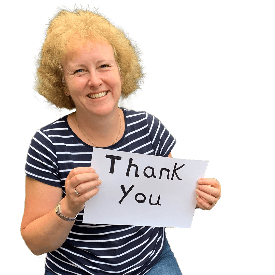 A member of the Volunteer Engagement team holding up a piece of paper with the words thank you