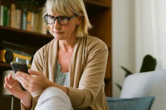 Woman reading the news on her phone