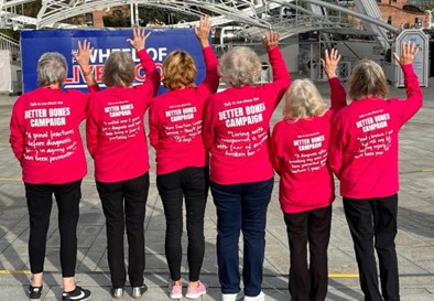 A group of 6 ROS volunteers wearing pink sweatshirts